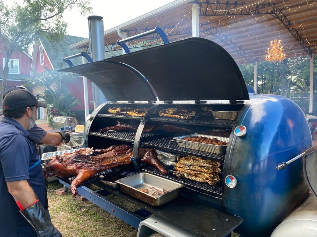 Smoker and chandelier beside the red barn at Horsepower Ranch